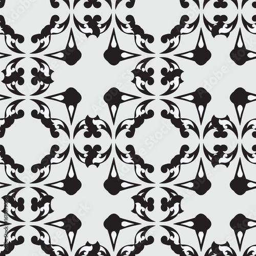 Elegant seamless pattern with black classic floral tracery on a white background. Vintage style. Vector illustration