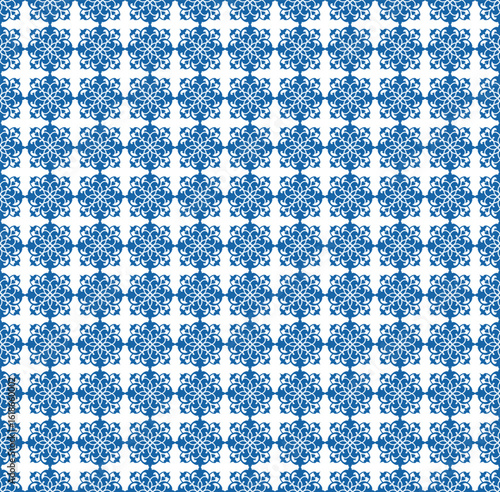 Seamless pattern with elegant blue floral tiles on white background, classic ornamental style