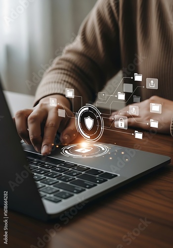 Person working on laptop with digital cybersecurity interface
