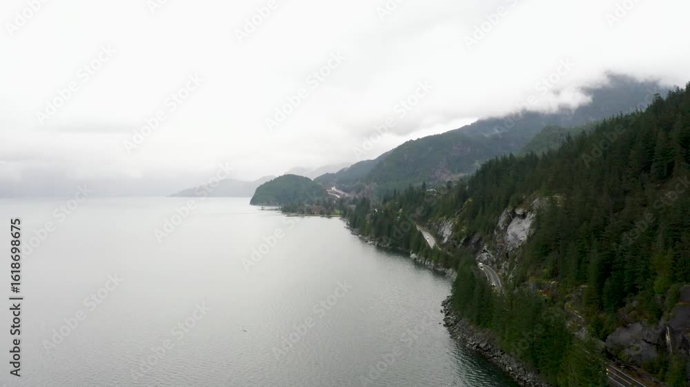 Coastal Highway Along Foggy Mountain Lake in British Columbia, Canada – Scenic Drone View Coastal Highway Along Foggy Mountain Lake in British Columbia, Canada – Scenic Drone View