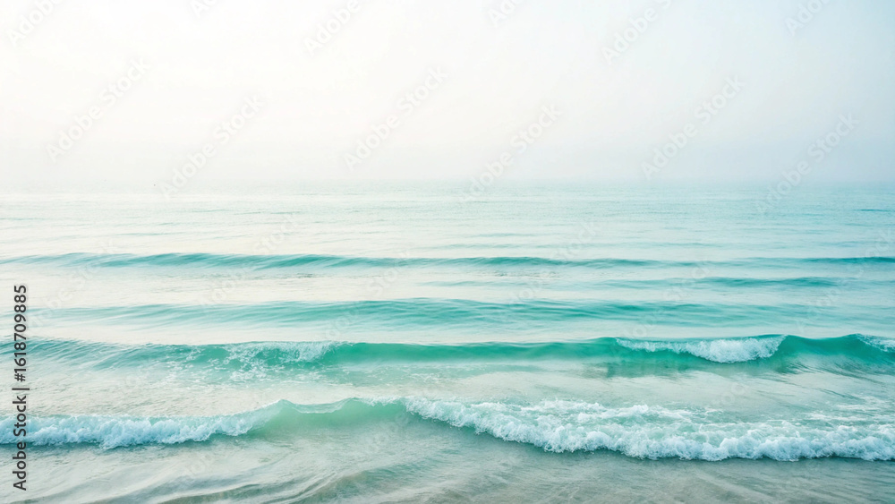 Fototapeta premium Serene ocean waves under a cloudy sky creating a tranquil and minimalist seascape