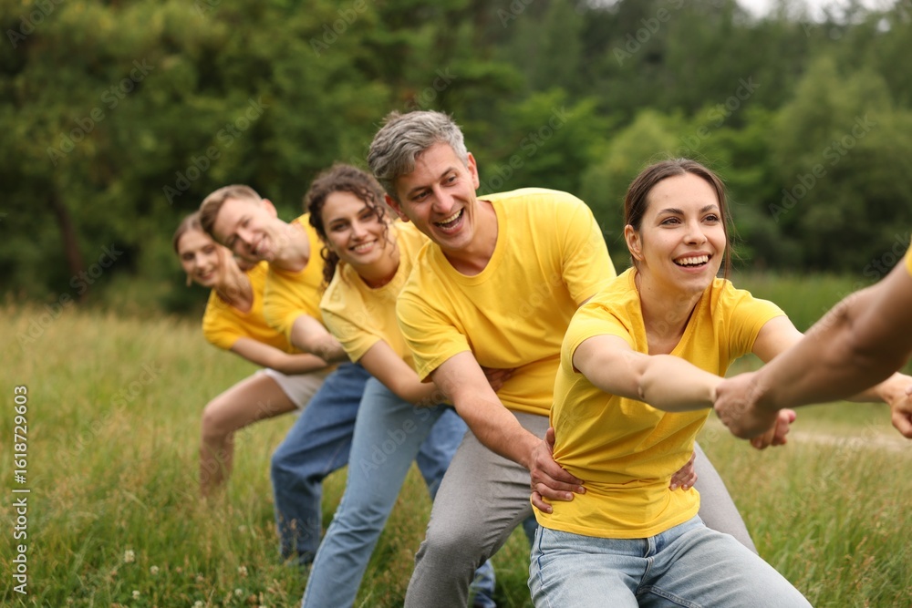Team building. Group of happy people holding hands outdoors Team building. Group of happy people holding hands outdoors