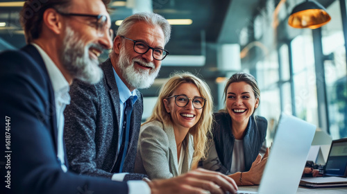 Business professionals of multiple generations share ideas while working on a laptop. The scene captures a positive, collaborative energy with cinematic lighting, promoting diversity, inclusion, and d