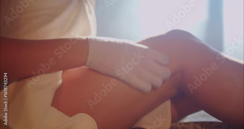 Wallpaper Mural Woman exfoliating her legs in the morning Torontodigital.ca