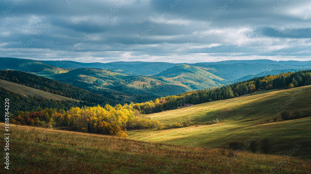 Obraz premium Mountain view in autumn, beautiful landscapes of hills under clouds