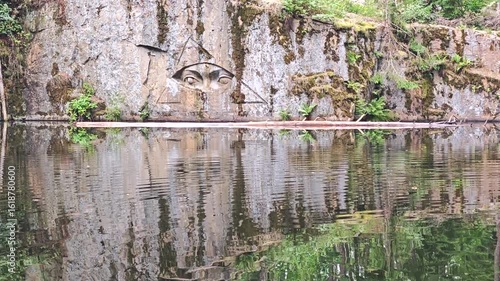 Lipnice nad Sazavou, Czech Republic,  2025-07-26. The engraved eye (Zlaty voci) above clear water of abandoned granite mine