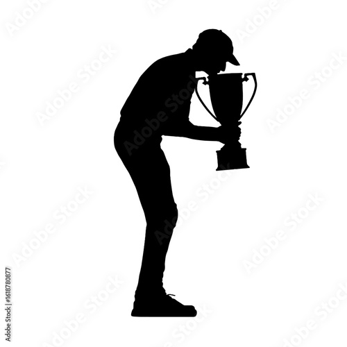 A silhouette of a man celebrating a win by kissing his trophy.