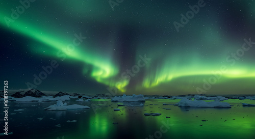 Wallpaper Mural A mesmerizing display of the aurora borealis over a serene landscape with icebergs and water reflections Torontodigital.ca