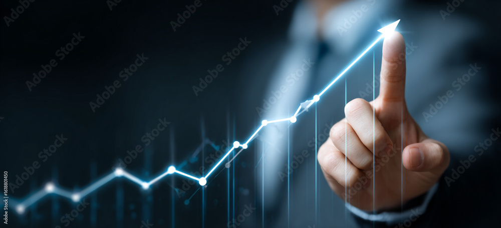 Businessman touching a glowing upward arrow graph symbolizing business growth, success, and financial progress
Businessman touching a glowing upward arrow graph symbolizing business growth, success, and financial progress