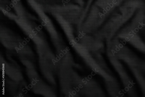 Close-Up of Black Ripstop Nylon Fabric with Wrinkles and Grid Texture