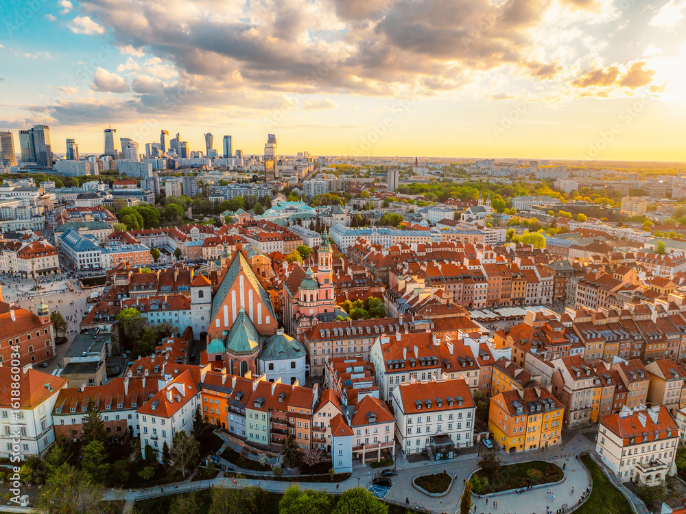 Fototapeta premium Warsaw old city center and skyscrapers in the background Vistula river. Sunset in Warsaw city center aerial view.