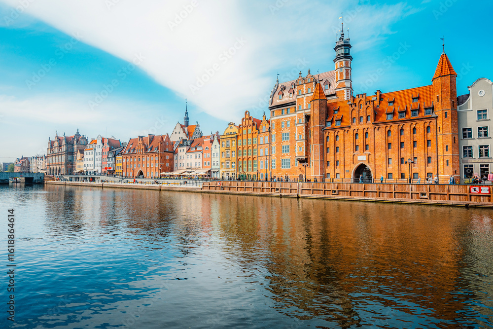Fototapeta premium Gdansk with Motlawa river in Poland. Old town colourful house with Holy Spirit Gate