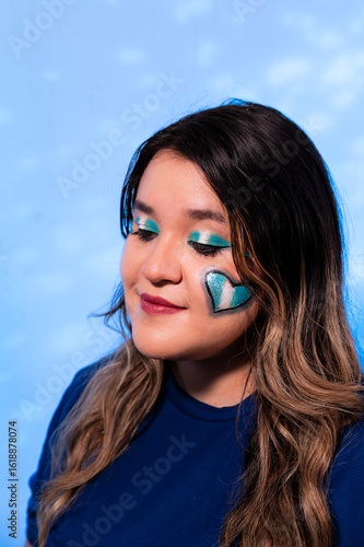 Female Portrait with Guatemalan Themed Makeup and Light Blue Background