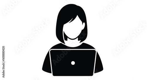 A woman working on a laptop computer with a focused expression