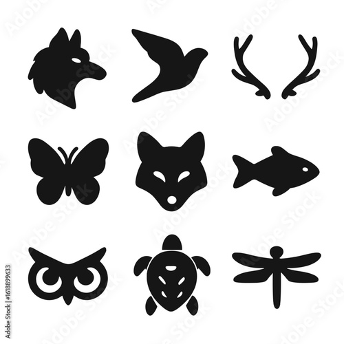 Animal Tattoo Icons. Solid, filled icon set of Animal-themed tattoos: wolf head, bird in flight, deer antlers, butterfly, fox face