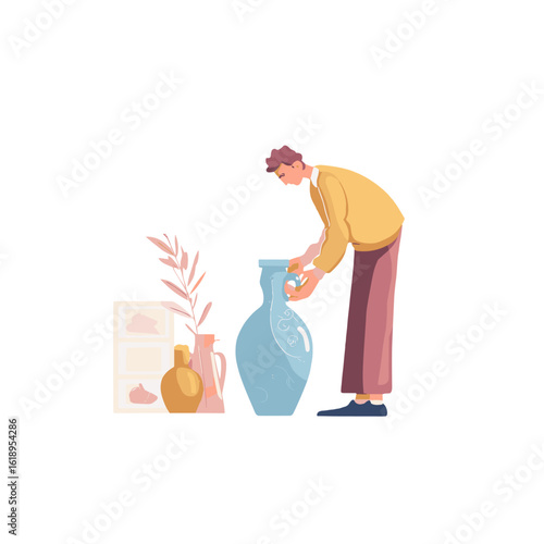 A man arranging vases and decorations in an interior space.