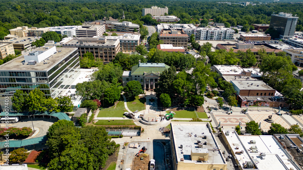 Fototapeta premium Aerial view flying towards Decatur square in Decatur Georgia on a beautiful sunny day 