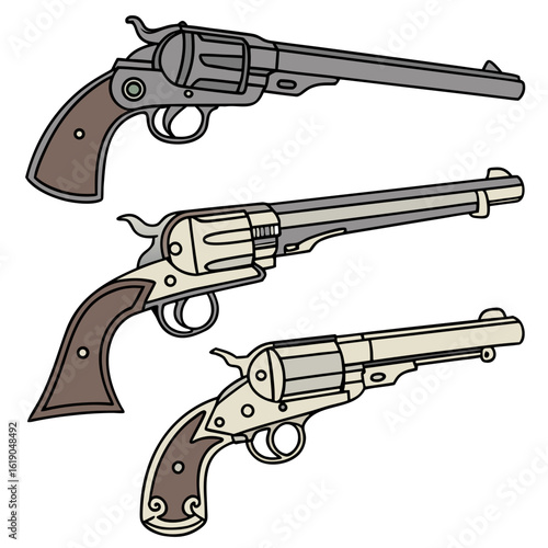 Three vintage revolvers in varying shades of gray and brown displayed on a white background surface created with generated ai