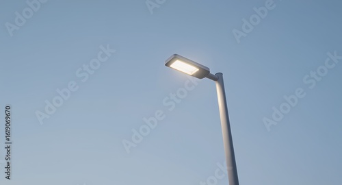 Modern LED Street Light Illuminating Clear Blue Sky  Urban Lighting Solution with Bright Fixtu