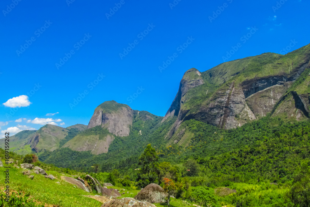 Fototapeta premium Tres Picos nature park in Brazil with granite mountain peaks, lush forest and natural landscape. Towering rock formations hiking, climbing, tourism area scenic wilderness in Brazil near Rio de Janeiro