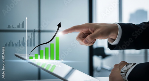 Business Hand Pointing at Rising Graph – Symbol of Growth and Financial Success