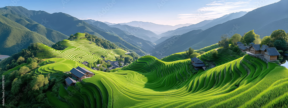Obraz premium Scenic Green Rice Terraces and Mountainside Villages Under a Clear Sky in Early Morning Light