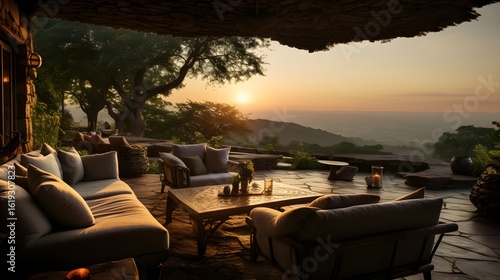 An inviting patio offers a breathtaking sunset view over the mountains, creating a sense of calm.