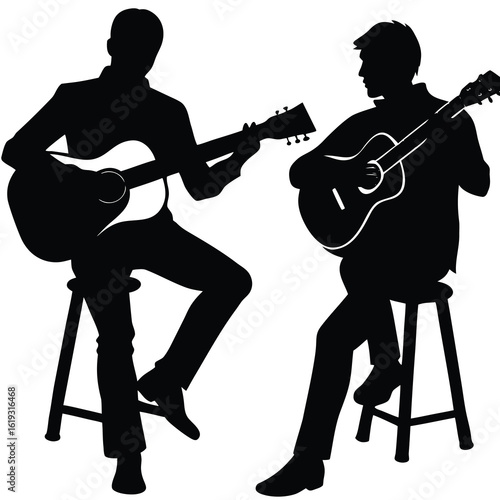 Two male musicians playing acoustic guitars silhouette