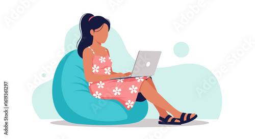 Woman working on laptop, sitting in beanbag chair - perfect for website banners, blog posts, and social media.
