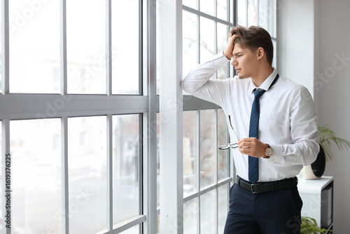 Young businessman suffering...