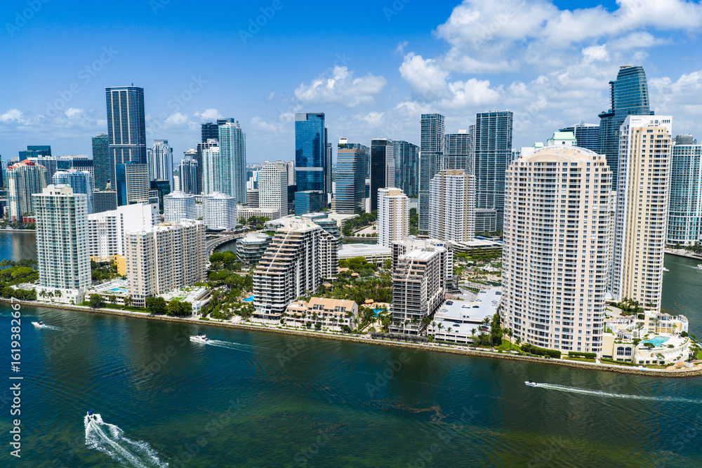 Fototapeta premium Drone view of Brickell skyscrapers. Brickell cityscape of downtown Miami. Panoramic Miami Brickell skyline above the coastline. Brickell Key aerial view in Miami. Landscape of Miami.