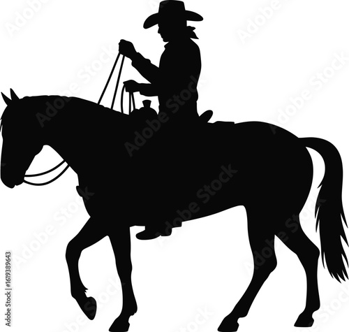 Silhouette of cowboy riding horse black
