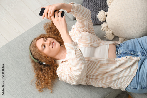 Young woman in headphones w...