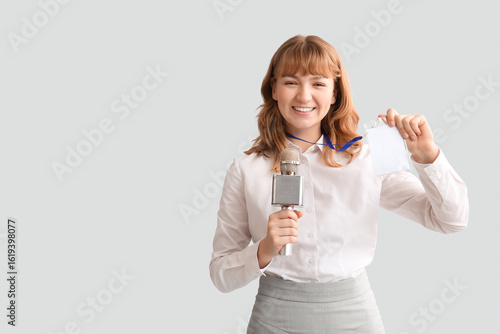 Young happy female reporter...
