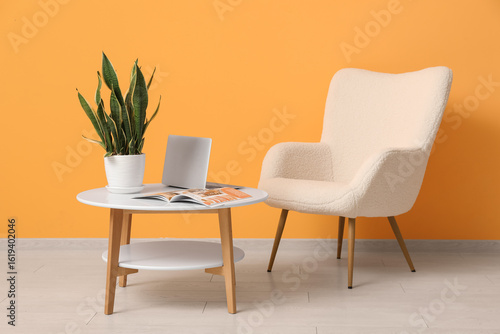Armchair, coffee table with...