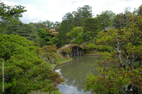 the famous royal japanese garden in kyoto with lush plants 