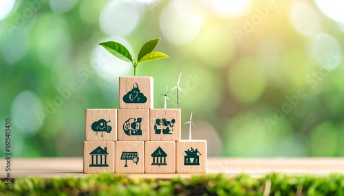 Wooden blocks with environmental icons and a sprout, set against a blurred green background