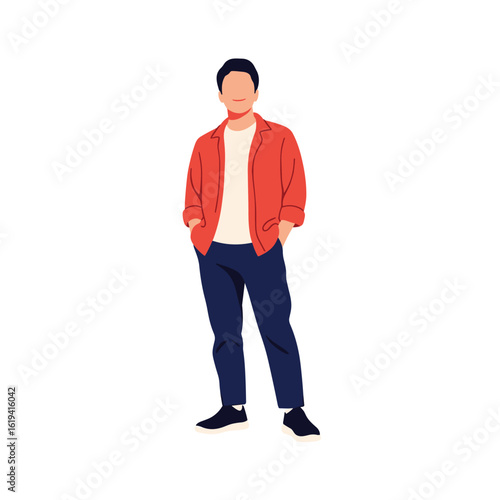 A stylish young man wearing an orange button down shirt and dark blue pants stands confidently with his hands in his pockets