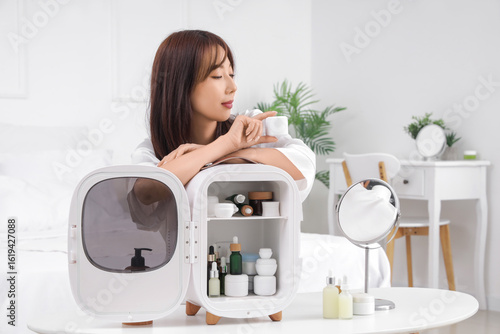 Pretty young woman with jar...