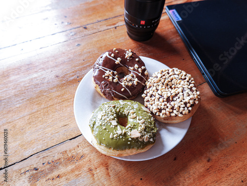 Work from cafe, accompanied by various flavor donuts, matcha, peanut and chocolate