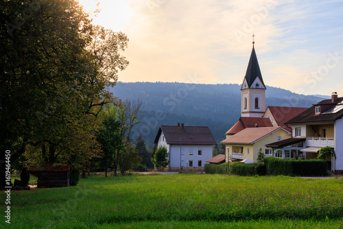Parish church of the Sacred Heart of Jesus in village Ludwigsthal (Lindberg) with Bavarian Forest National Park mountain panorama, Germany