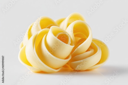 Pale yellow curls of butter, artfully arranged
