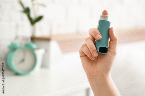 Woman holding modern inhale...