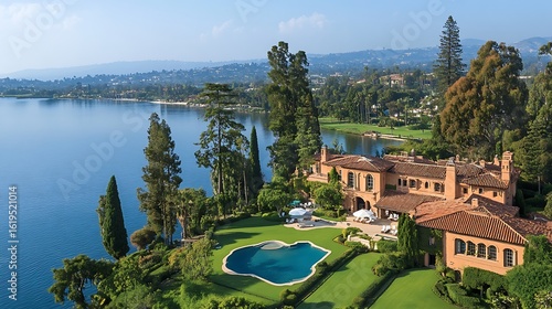 Luxurious lakefront estate with extensive grounds.