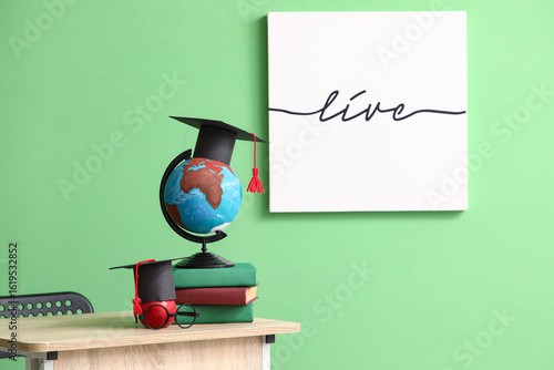 School desk with globe, app...