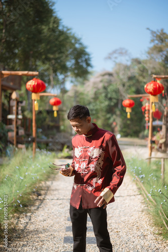 A man dressed in Chinese New Year clothing
