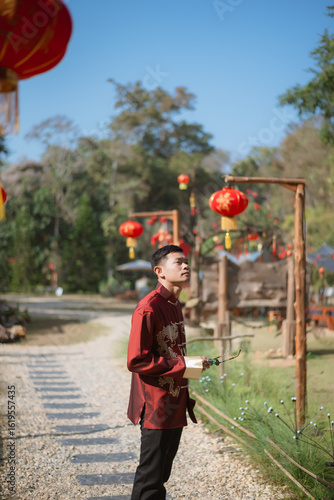 A man dressed in Chinese New Year clothing