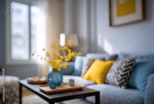 Wallpaper Mural Sunlit living room, blurred, featuring a gray sofa with yellow and blue cushions, a coffee table, and yellow flowers Torontodigital.ca
