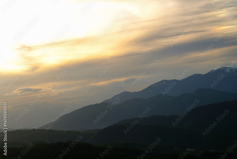 Obraz premium Rolling hills and sunset sky over serene mountain nature landscape. Armenia