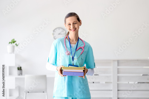 Smiling young female doctor...